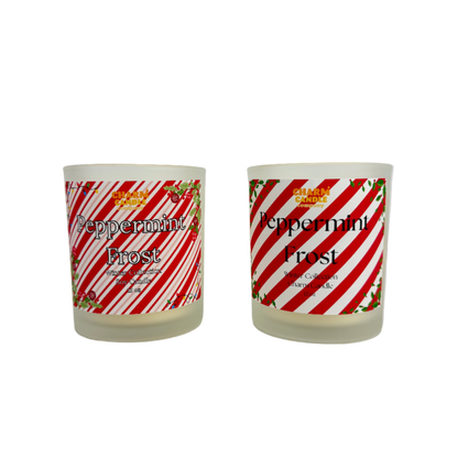 Two 'Peppermint Frost' candles with candy cane design labels on a white background
