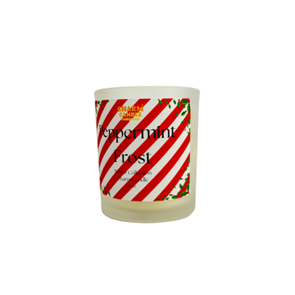 Candle with a peppermint-themed label on a white background