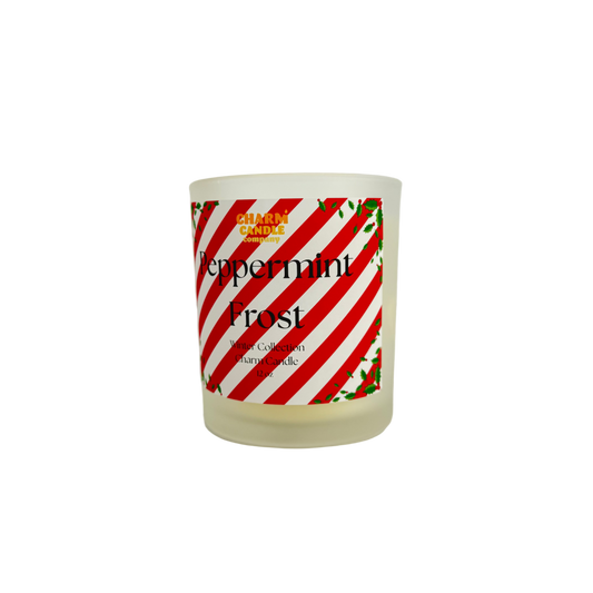 Candle with a peppermint-themed label on a white background